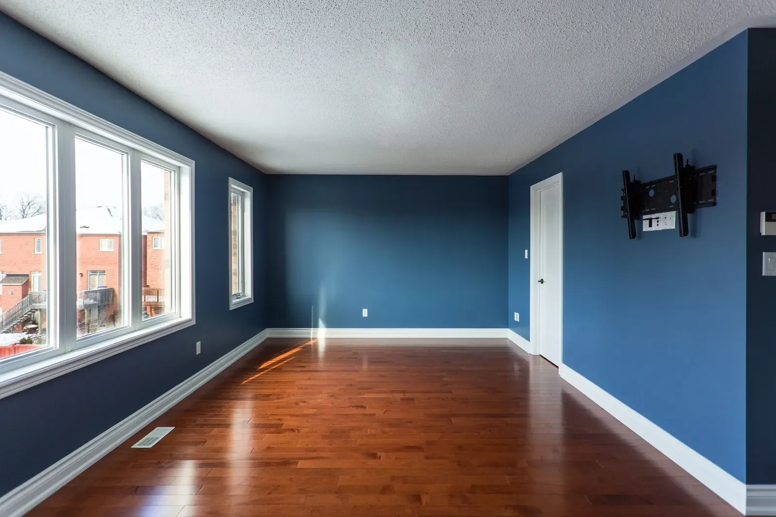 Bold blue feature wall neatly painted
